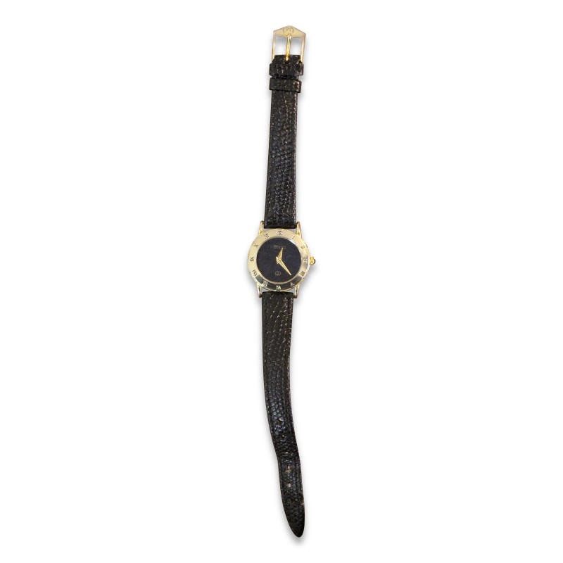 \"Gucci\"-Uhr mit goldfarbenem Gehäuse und schwarzem Lederarmband. - Moinat - Dekorationszubehör